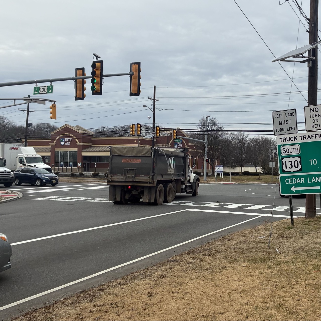 Dump truck at the Route 130 and Cedar Lane intersection in Florence Township, showing the truck traffic issue affecting our community
